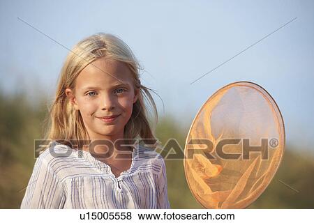Portrait of girl with fishing net View Large Photo Image Stock Photo - Portrait of girl with fishing net. Fotosearch