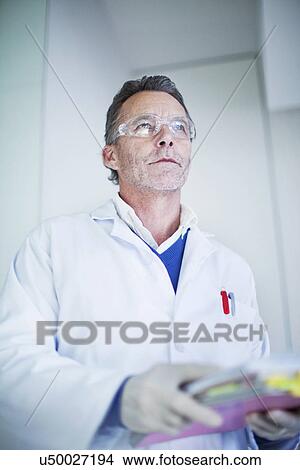 Portrait of male scientist wearing safety glasses View Large Photo Image Picture - Portrait of male scientist wearing safety glasses. Fotosearch