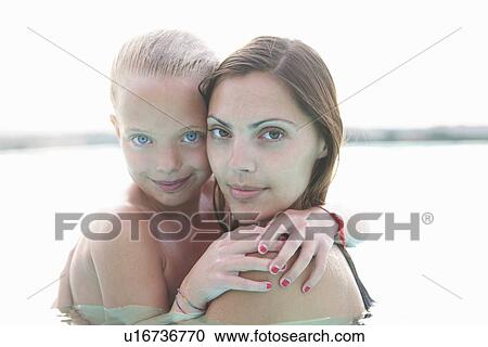 Portrait of mother and daughter in outdoor swimming pool View Large Photo Image Stock Image - Portrait of mother and daughter in outdoor swimming pool. Fotosearch