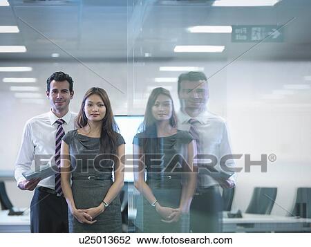 Portrait of office colleagues in meeting room reflected in window View Large Photo Image Stock Image - Portrait of office colleagues in meeting room reflected in window. Fotosearch