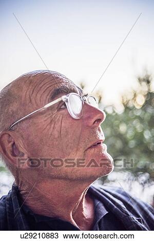 Portrait of senior man looking up View Large Photo Image Stock Image - Portrait of senior man looking up. Fotosearch