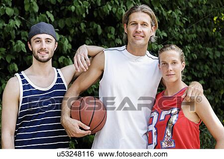 Portrait of three basketball players in park View Large Photo Image Stock Photograph - Portrait of three basketball players in park. Fotosearch
