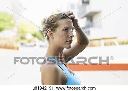 Stock Image - Portrait of young female athlete. Fotosearch