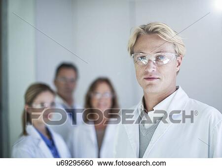 Portrait of young male scientist wearing safety glasses View Large Photo Image Stock Image - Portrait of young male scientist wearing safety glasses. Fotosearch