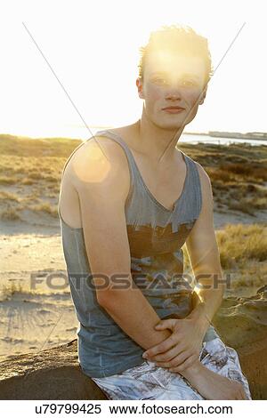 Stock Photography - Portrait of young man in sunlight. Fotosearch