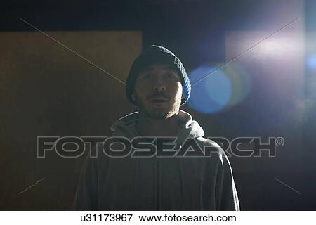 Portrait of young man wearing knit hat and hooded top View Large Photo Image Stock Photo - Portrait of young man wearing knit hat and hooded top. Fotosearch