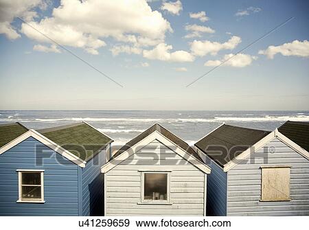Row of blue beach huts, Southwold, Suffolk, UK View Large Photo Image Stock Photo - Row of blue beach huts, Southwold, Suffolk, UK. Fotosearch