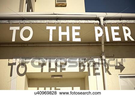 Stock Photo - Sign to Southwold Pier, Southwold, Suffolk, UK. Fotosearch