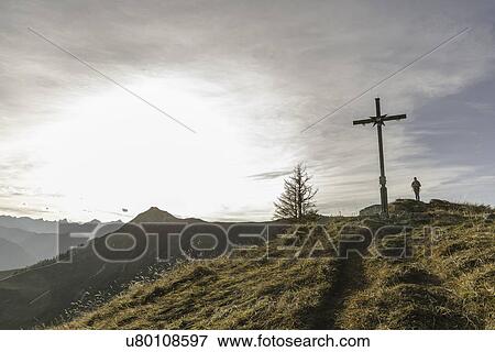 Silhouette of mid adult woman and wooden cross, Achensee, Tyrol, Austria View Large Photo Image Stock Photo - Silhouette of mid adult woman and wooden cross, Achensee, Tyrol, Austria. Fotosearch