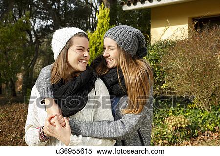 Sisters hugging in garden View Large Photo Image Stock Photography - Sisters hugging in garden. Fotosearch