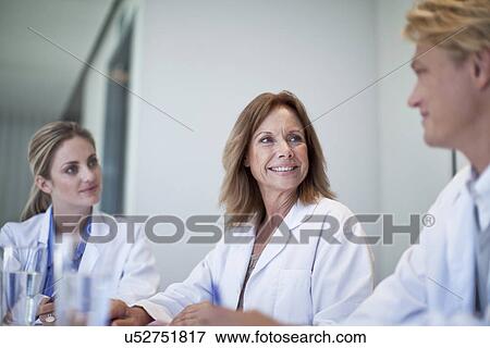 Stock Photo - Small group of doctors meeting in the conference room. Fotosearch