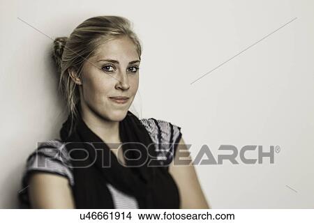 Studio portrait of teenage girl smirking View Large Photo Image Picture - Studio portrait of teenage girl smirking. Fotosearch