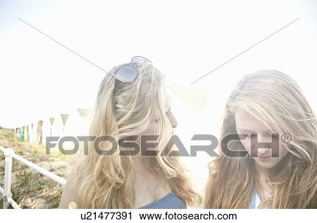 Teenage girls, beach huts in background, Southwold, Suffolk, UK View Large Photo Image Stock Image - Teenage girls, beach huts in background, Southwold, Suffolk, UK. Fotosearch