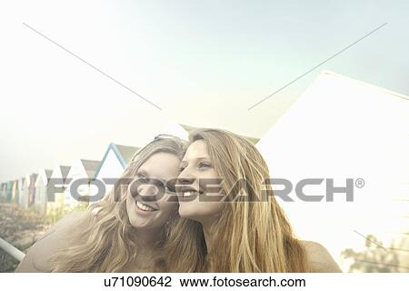 Teenage girls, beach huts in background, Southwold, Suffolk, UK View Large Photo Image Stock Image - Teenage girls, beach huts in background, Southwold, Suffolk, UK. Fotosearch