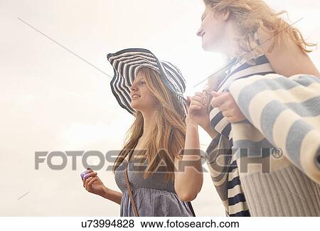 Stock Photo - Teenage girls wearing sundresses. Fotosearch