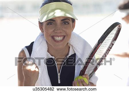 Stock Image - Tennis player celebrating. Fotosearch