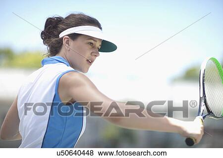 Stock Photo - Tennis player slicing. Fotosearch