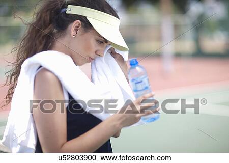 Tennis player taking break View Large Photo Image Stock Image - Tennis player taking break. Fotosearch
