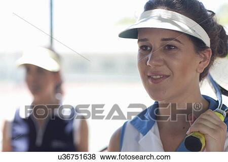 Stock Photo - Tennis players observing. Fotosearch