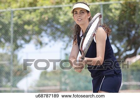 Stock Photo - Tennis players returning ball. Fotosearch