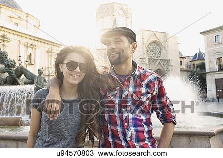 Tourist couple posing, Plaza de la Virgen, Valencia, Spain View Large Photo Image Stock Image - Tourist couple posing, Plaza de la Virgen, Valencia, Spain. Fotosearch