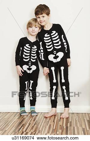Two boys dressed in skeleton outfits View Large Photo Image Picture - Two boys dressed in skeleton outfits. Fotosearch