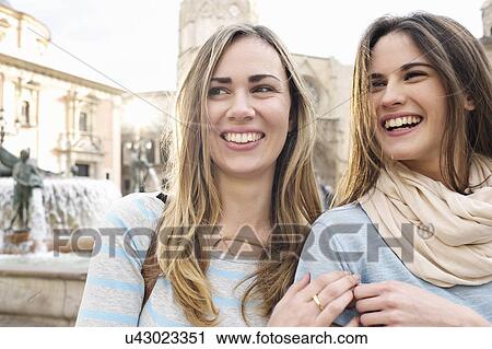 Two young female tourists, Plaza de la Virgen, Valencia, Spain View Large Photo Image Stock Image - Two young female tourists, Plaza de la Virgen, Valencia, Spain. Fotosearch