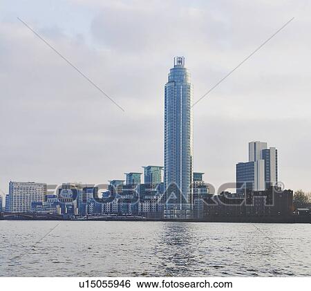 Stock Photograph - View of office and apartment blocks on the Thames, London, UK. Fotosearch