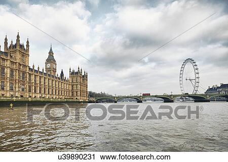 View of the London Eye and the Houses of Parliament, London, UK View Large Photo Image Stock Image - View of the London Eye and the Houses of Parliament, London, UK. Fotosearch