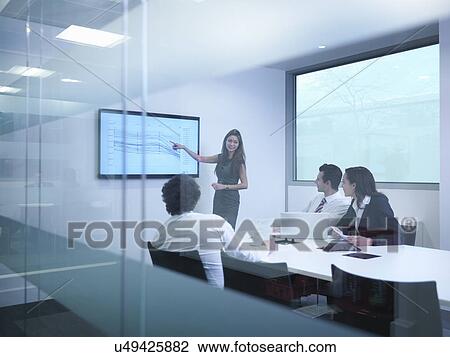 View through glass wall of business colleagues using screen in meeting View Large Photo Image Stock Image - View through glass wall of business colleagues using screen in meeting. Fotosearch
