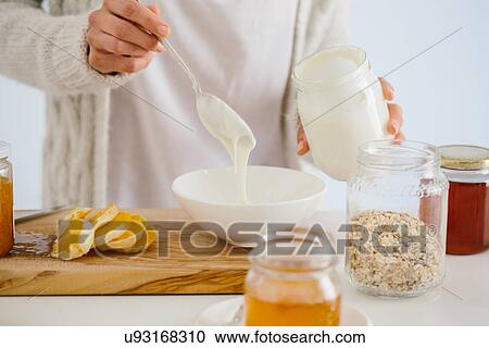 Woman having muesli and fruit View Large Photo Image Stock Image - Woman having muesli and fruit. Fotosearch