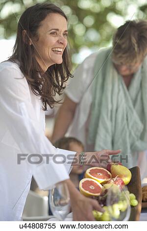 Woman serving platter of fruits View Large Photo Image Stock Photography - Woman serving platter of fruits. Fotosearch