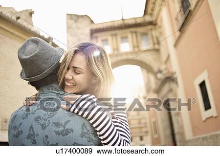Stock Photo - Young couple hugging, Valencia, Spain. Fotosearch