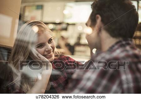 Young couple in cafe View Large Photo Image Stock Photograph - Young couple in cafe. Fotosearch