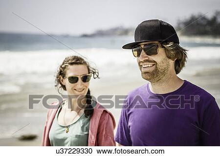 Young couple walking, Laguna Beach, California, USA View Large Photo Image Stock Image - Young couple walking, Laguna Beach, California, USA. Fotosearch