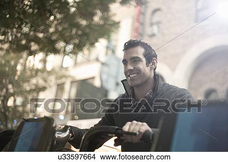 Young male tourist on bicycle, New York City, USA View Large Photo Image Picture - Young male tourist on bicycle, New York City, USA. Fotosearch
