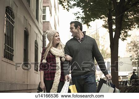Young tourist couple arm in arm, New York City, USA View Large Photo Image Stock Photograph - Young tourist couple arm in arm, New York City, USA. Fotosearch