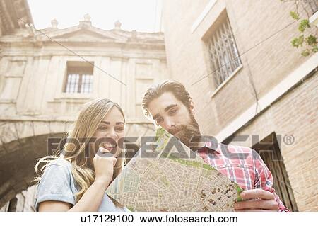 Young tourist couple looking at map outside Valencia Cathedral, Valencia, Spain View Large Photo Image Stock Image - Young tourist couple looking at map outside Valencia Cathedral, Valencia, Spain. Fotosearch