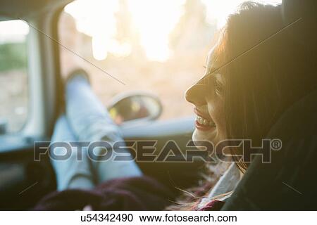 Young woman enjoying car ride View Large Photo Image Stock Image - Young woman enjoying car ride. Fotosearch