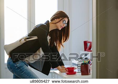 Young woman getting ready to go out View Large Photo Image Stock Photo - Young woman getting ready to go out. Fotosearch