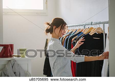 Young woman getting ready to go out View Large Photo Image Stock Photography - Young woman getting ready to go out. Fotosearch