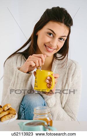 Young woman having honey drink View Large Photo Image Stock Image - Young woman having honey drink. Fotosearch