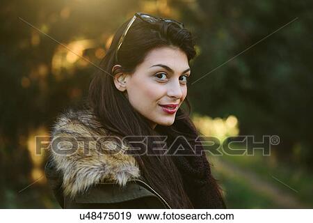 Young woman in the woods View Large Photo Image Stock Photo - Young woman in the woods. Fotosearch