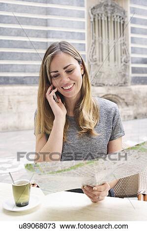 Young woman looking at map outside Museum of Ceramics, Valencia, Spain View Large Photo Image Stock Image - Young woman looking at map outside Museum of Ceramics, Valencia, Spain. Fotosearch