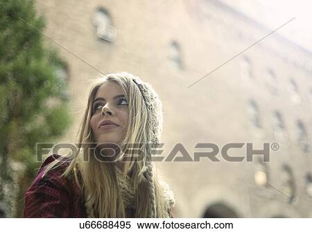 Young woman looking over her shoulder, New York City, USA View Large Photo Image Stock Photography - Young woman looking over her shoulder, New York City, USA. Fotosearch