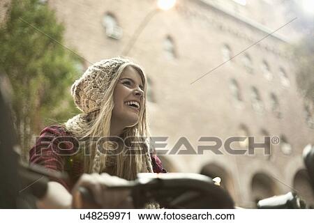 Young woman on bicycle, New York City, USA View Large Photo Image Stock Image - Young woman on bicycle, New York City, USA. Fotosearch