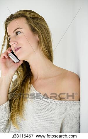 Young woman on phonecall View Large Photo Image Stock Photo - Young woman on phonecall. Fotosearch