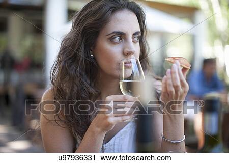 Young woman smelling wine at vineyard bar View Large Photo Image Stock Image - Young woman smelling wine at vineyard bar. Fotosearch