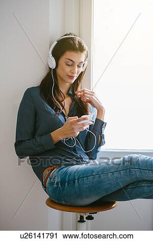 Young woman with headphones View Large Photo Image Stock Image - Young woman with headphones. Fotosearch