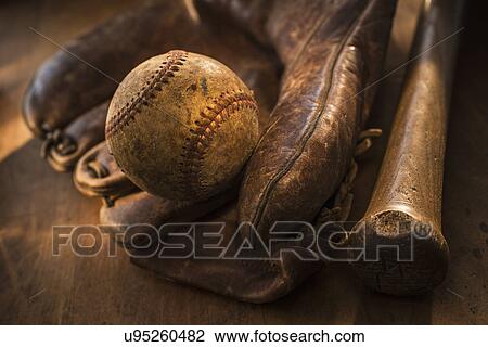 Stock Image - Antique baseball, glove and bat. Fotosearch